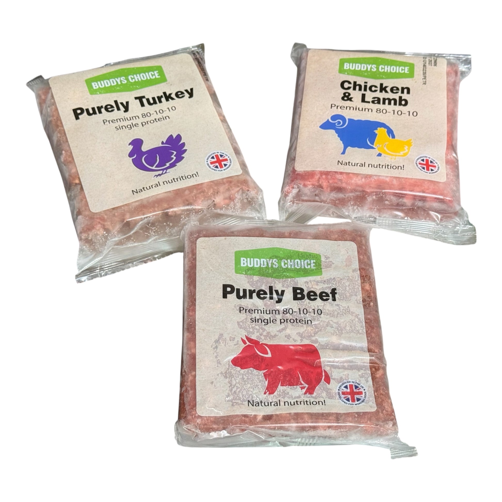 Three packages of Buddy's Choice pet food with different meats on a white background