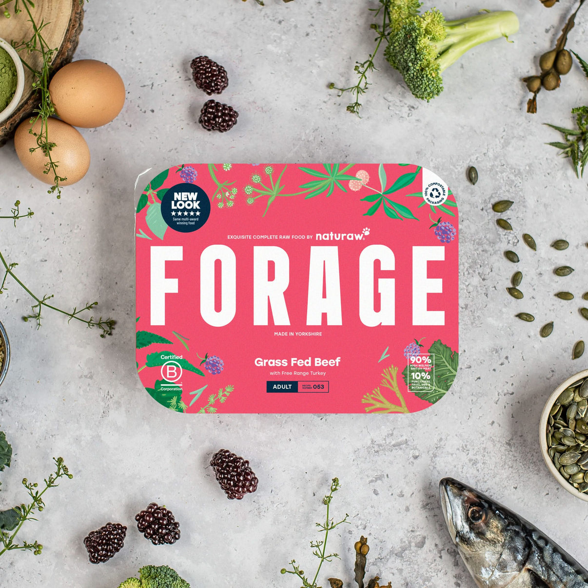Naturaw Forage pet food packaging on a textured surface with natural elements.