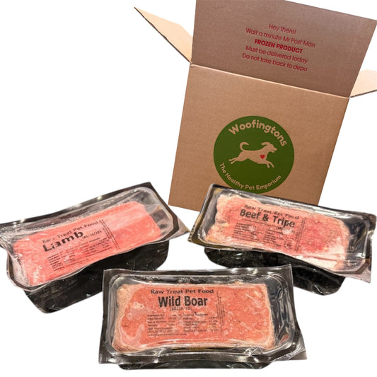 Raw pet food packages with Woofingtons branding on a white background